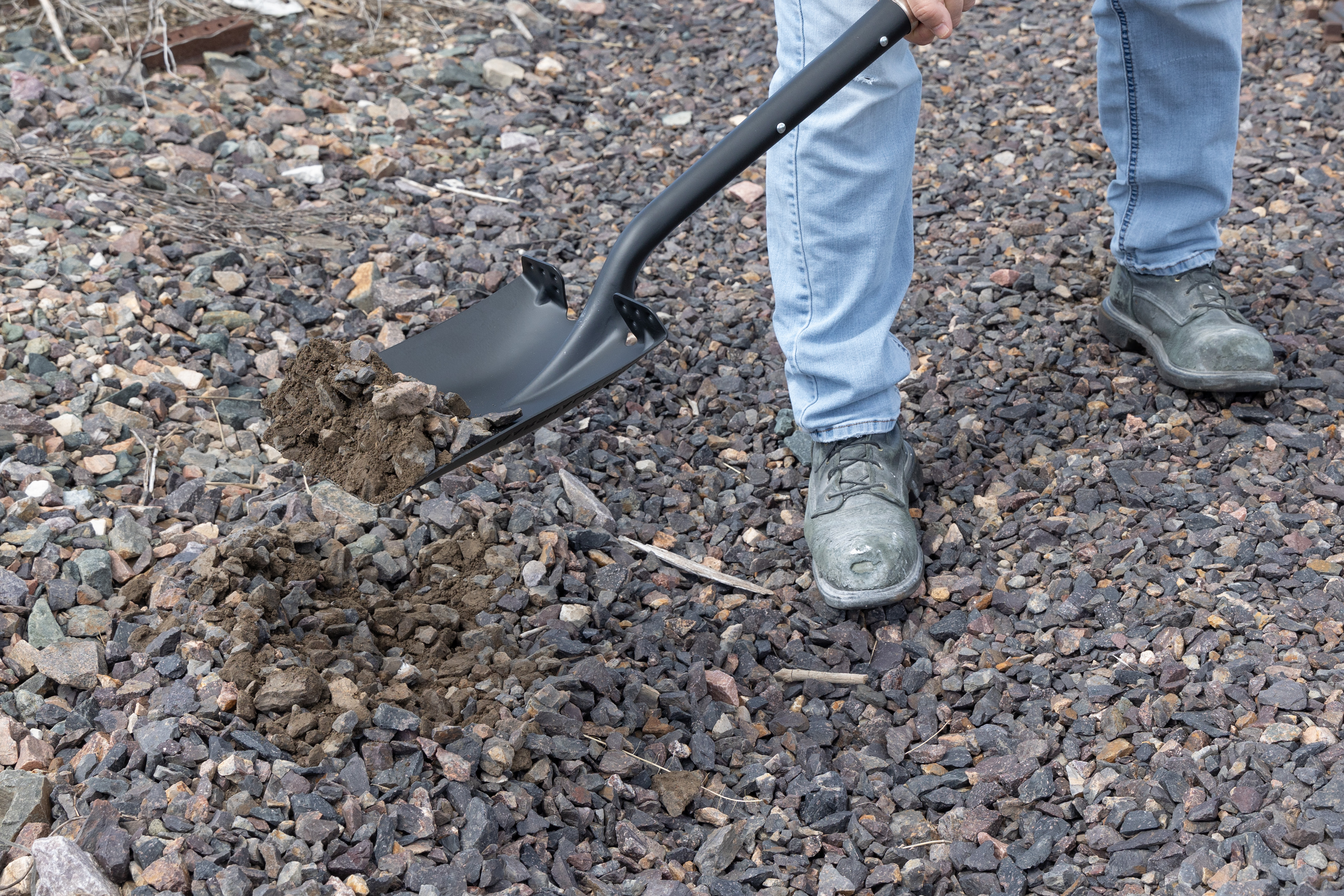 man moving gravel